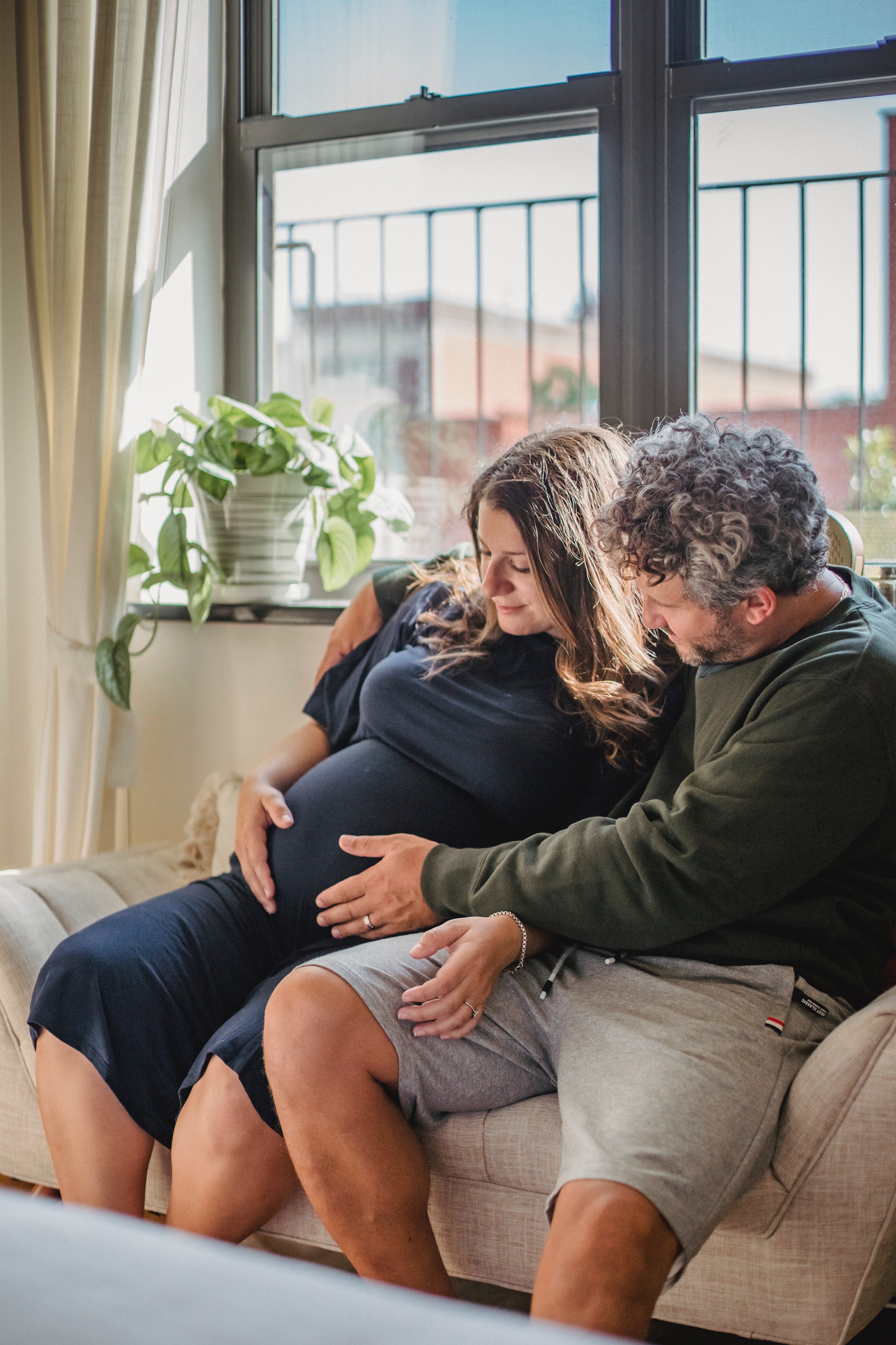 wtg mom and dad hold belly