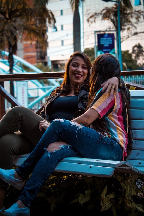 wtg queer women sitting on park bench
