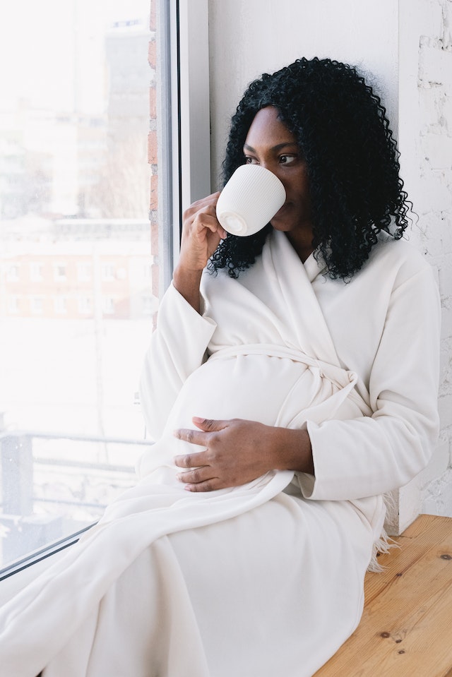 wTG pregnant woman drinking coffee