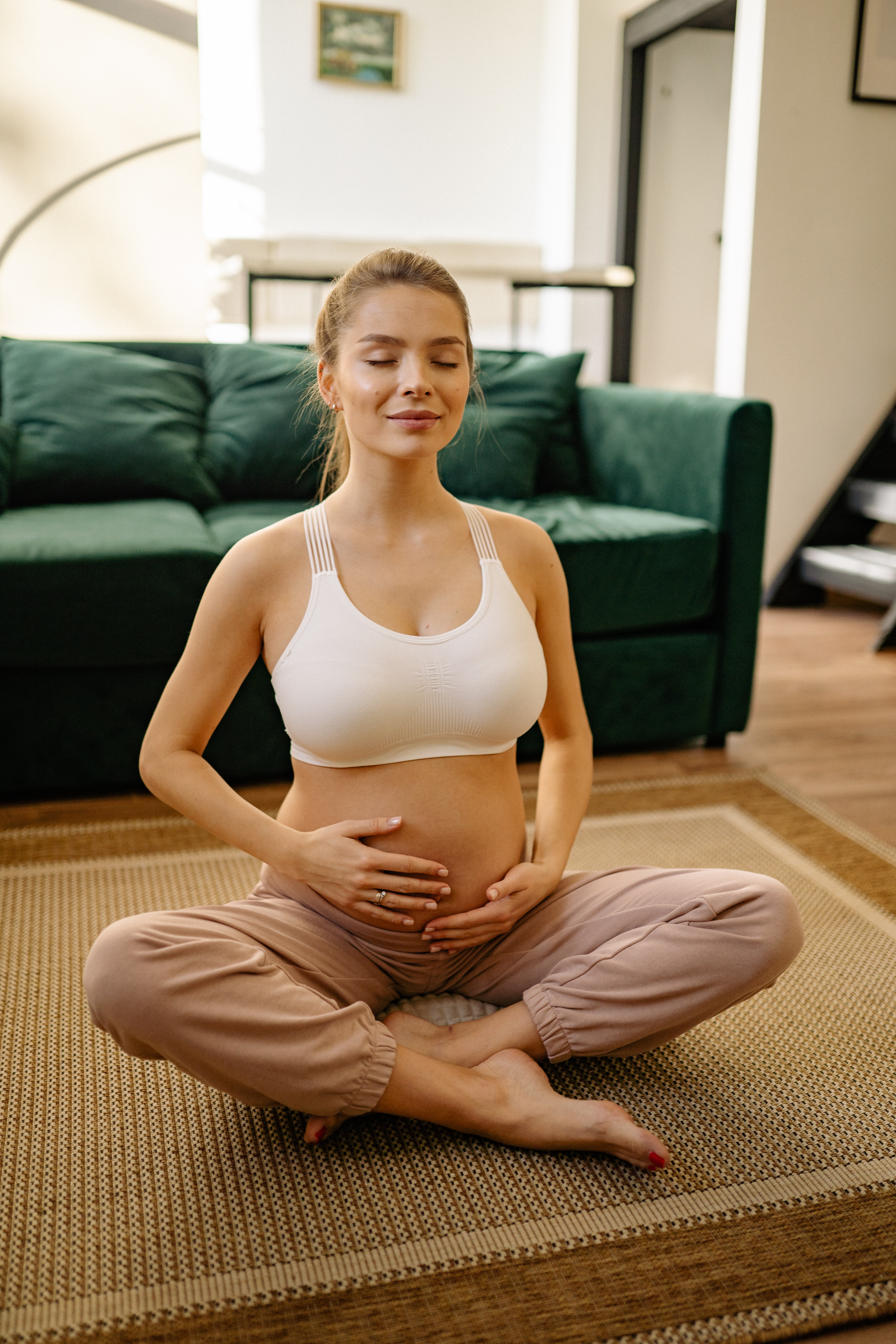 wtg woman pregnant and doing yoga
