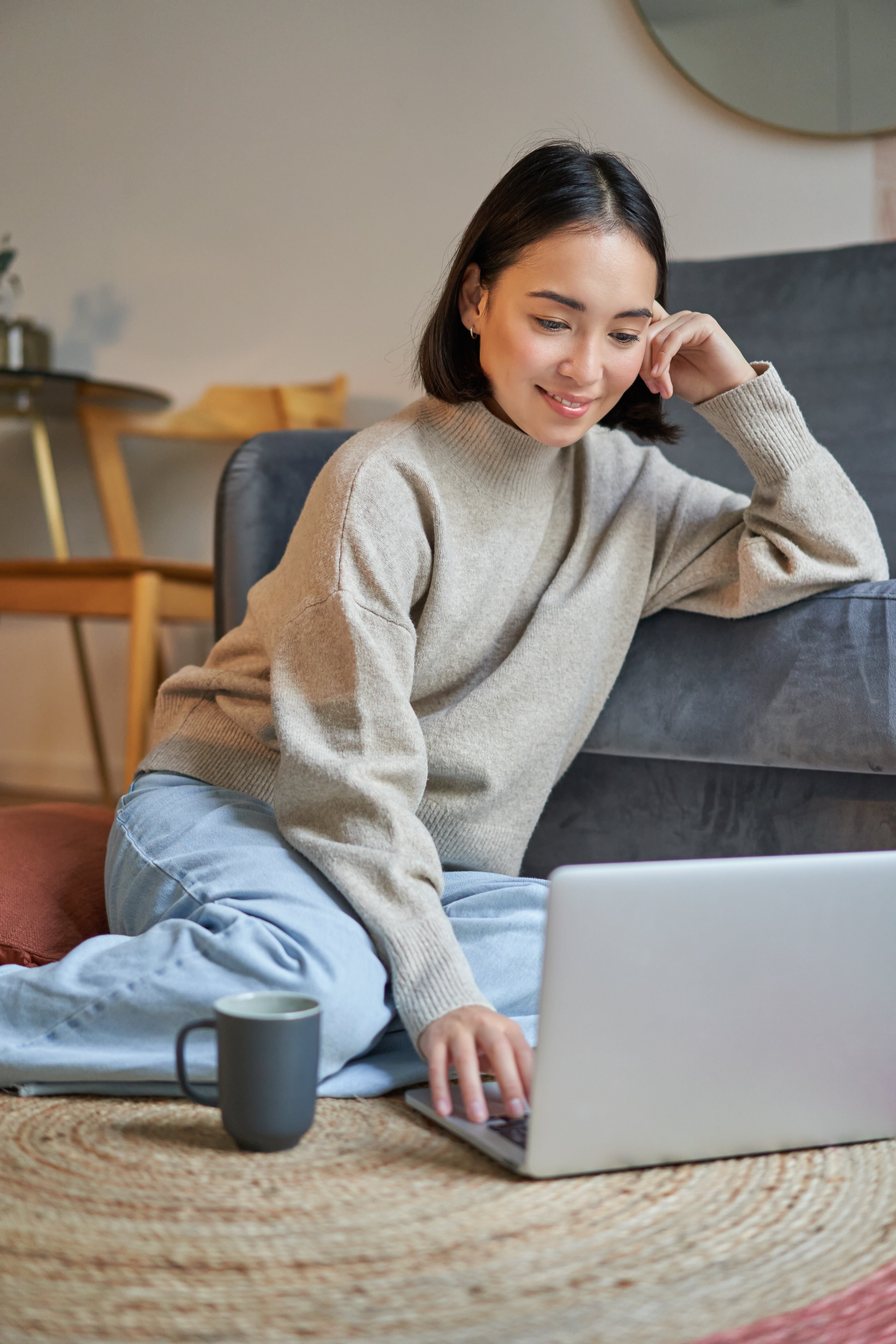 vertical-shot-of-young-woman-in-cozy-home-working-2023-01-11-22-49-54-utc