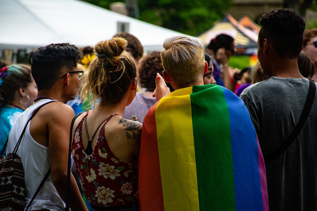 Williamsburg Therapy Group LGBTQ group standing with a pride flag